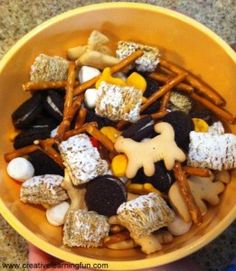 a yellow bowl filled with different types of snacks