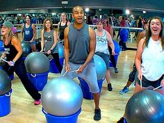 a group of people doing exercises on exercise balls