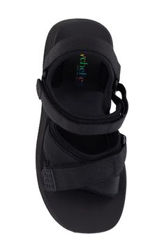 Channel sporty, modern style in this monochrome sandal set on a lofty platform sole. 2 1/4" heel; 1 1/2" platform Adjustable ankle strap with hook-and-loop closure Textile upper and lining/synthetic sole Imported Casual Black Sport Sandals With Chunky Platform, Adjustable Ankle Strap Platform Sport Sandals, Adjustable Platform Sport Sandals With Ankle Strap, Casual Sport Sandals With Chunky Platform And Ankle Strap, Chunky Platform Sport Sandals With Ankle Strap, Synthetic Ankle Strap Sport Sandals, Synthetic Sport Sandals With Ankle Strap And Heel Loop, Black Sport Sandals With Heel And Ankle Straps, Platform Wedge Sandals