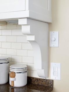 two buckets sitting on top of a kitchen counter