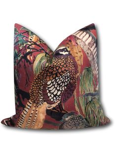 a decorative pillow with an image of birds on it