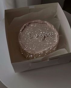 a cake in a box with the words i love you written on it's side