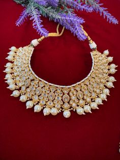 High gold plated designer Tyaani Kundan set with matching Chandbali. Next to real anti tarnish platting, hypoallergenic. Suitable for anything . Can be worn as a necklace or choker. About 1.5 inch wide on the neck. Earring is 2 inch long , push back and very very light weight . Kundan Choker With Intricate Design, Traditional Kundan Choker Necklace With Intricate Design, Ceremonial Kundan Choker With Intricate Design, Traditional Kundan Choker With Intricate Design, Heavy Traditional Kundan Choker Necklace, Traditional Heavy Kundan Choker Necklace, Traditional Kundan Choker Necklace For Ceremonial Occasions, Ceremonial Traditional Kundan Choker Necklace, Bridal Temple Jewelry Cutdana Choker