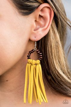 A trio of yellow suede tassels are knotted in place at the bottom of a wooden beaded frame, creating an earthy fringe. Earring attaches to a standard fishhook fitting.Sold as one pair of earrings. Wooden Bead Earrings, Yellow Tassel Earrings, Beaded Frame, Paparazzi Accessories Jewelry, Fringe Earring, Beaded Earrings Patterns, Suede Tassel, Rings Silver, Earrings Inspiration