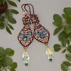 These Boho Earrings are handmade for royalty. These are fit for the Queen you are! Walk with confidence, stand tall, sparkle and dazzle them all! Various pink toned beads and turquoise beads are wrapped to perfection in these beauties!  Swarovski faceted beads dangle below! Lots of color! Boho inspired!! Earring Ideas, Wire Earrings, Stand Tall, Beaded Dangles, Turquoise Beads, Faceted Bead, Boho Earrings, The Queen, Earrings Handmade