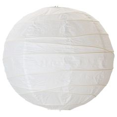 a round white paper lantern hanging from a wire on a white background with clippings