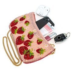 Juice up your wardrobe with Mary Frances' Strawberry Fields. This sweet crossbody handbag mixes fiery red, beaded strawberries on a sparkling pink backdrop to make a pairing that's on fire! 10.75 x 1.25 x 6" Strap Length End to End: 49" Strap Drop: 23" Removable crossbody chain strap Zipper closure Inside pocket Back pocket Fits a phone Includes: metal logo fob, protective storage bag, certificate of authenticity This is a handmade item, each one an individual work of art. Slight variations may Lovecore Fashion, Strawberry Purse, Diy Purse Making, Handbag Diy, Teapots Unique, Pink Backdrop, Mary Frances, People Clothes, Strawberry Fields