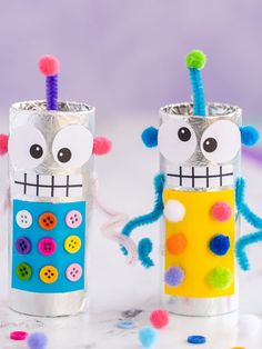 two tin can crafts with buttons on them