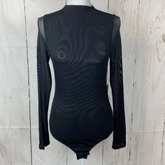 Black Bodysuit Snap Crotch Long Sheer Sleeve High Neck Size L (Jr) Shoulder To Shoulder 12.5” Armpit To Armpit 14.5” Length 28” Width Of Sleeve 7.5 Top Width Of Sleeve 4” Bottom 16 Spring Fitted Bodysuit With Mesh Sleeves, Fitted Bodysuit With Mesh Sleeves For Spring, Black Fitted Bodysuit With Sheer Sleeves, Fitted Black Bodysuit With Sheer Sleeves, Chic Black Bodysuit With Mesh Sleeves, Spring Bodysuit With Mesh Sleeves, Black Long Sleeve Sheer Bodysuit, Black Sheer Long Sleeve Bodysuit, Black Bodysuit For Spring Workwear