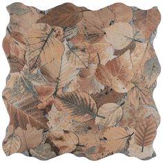 a decorative pillow with leaves on it