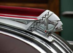 the hood ornament is designed to look like a woman's face