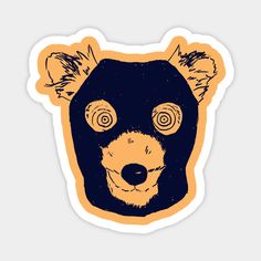 a sticker with a bear's head and eyes drawn in black on an orange background