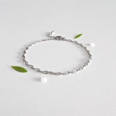 A dainty and minimalist chain bracelet for women with an elegant lace pattern. * LACE *  by Studio MND90 HANDCRAFTED WITH LOVE & CARE ------------------------------------------------- - Rhodium Silver plated - Stainless steel lace chain - 1.18 in (3 cm) chain extender DIMENSIONS ------------------ Length : adjustable from 6.30 in (16 cm) to 7,48 in (19 cm) QUICKLY DISPATCHED ! --------------------------------- Shipping within 1 business day with tracking number. Free standard delivery for LA POS Dainty Silver Stainless Steel Bracelets, Dainty Silver Stainless Steel Bracelet, Dainty Stainless Steel Bracelet With Adjustable Chain, Dainty Silver Metal Chain Bracelet, Dainty Silver Stainless Steel Chain Bracelet, Dainty Chain Bracelets For Wedding, Elegant Adjustable Silver Chain Bracelet, Adjustable Silver Chain Minimalist Bracelet, Elegant Stainless Steel Bracelet With Silver Chain