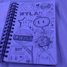 an open notebook with drawings on it