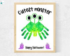 a green and black handprinted poster with the words cutest monster on it