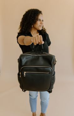 This is our Hybrid Bag that we just can't get enough of. A new take on our original Dawn bag. It has plenty of pockets and has a convertible shoulder strap. This bag will quickly become one of your favorites. The multipurpose design will replace your school bag, diaper bag, work bag into this everyday bag. It's a must have bag! Modern Diaper Bag With Adjustable Strap For On-the-go, On-the-go Backpack Diaper Bag With Adjustable Strap, On-the-go Diaper Bag Backpack With Adjustable Strap, On-the-go Satchel Diaper Bag With Detachable Strap, Functional On-the-go Diaper Backpack, Functional Diaper Bag Backpack For On-the-go, Large Capacity Satchel Diaper Bag For On-the-go, On-the-go Diaper Bag Backpack With Removable Pouch, On-the-go Diaper Backpack With Zipper