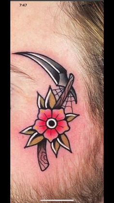 a man with a tattoo on his neck has a flower and an arrow in it