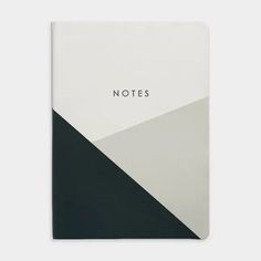 a notebook with the words notes written in black, white and grey on top of it