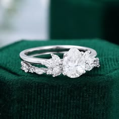 a close up of a ring on top of a green cloth