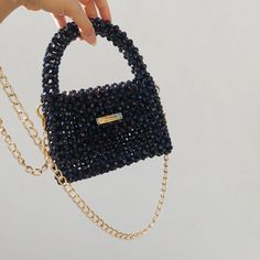 The shiny black bead bag, made with care and 100% hand labour, is a great option to accompany you on your special days. You can gift it to your loved ones. Gold chain detail gives a different aesthetic to the handmade black bead bag. It will be sent in a storage pouch and you can keep your bag in this way. Your phone, lipstick, airpods, cards and other minimal items can easily fit inside.  *Details - Completely handmade - High quality, colourfast acrylic beads - Suitable for phone, wallet, basic Bead Purse, Bead Bag, Bag Aesthetic, Bag Elegant, Elegant Bags, Beaded Purses, Black Acrylics, Bag Handmade, Beaded Bags