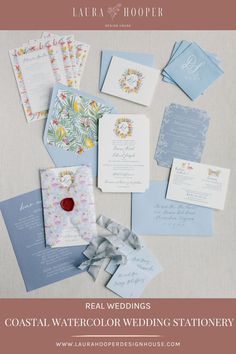 the wedding stationery is laid out on top of each other