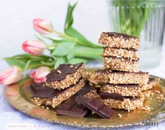 chocolate and graham crackers stacked on top of each other with flowers in the background