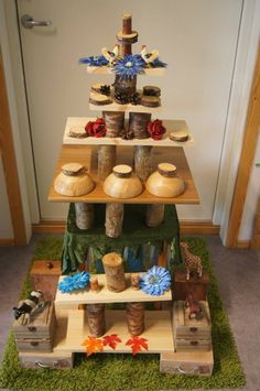 three tiered display with jars and other items