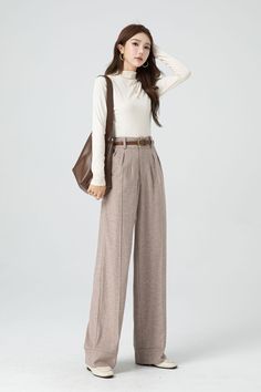 With its timeless silhouette and luxurious feel, this womens bespoke high waist wide leg wool pants is a true investment piece that will elevate any outfit to new levels of refinement and class. DETAIL * 30% wool, 30% fiber, 40% polyester * Fully satiny lining, more nice to the touch body * Two side seam pockets * Front button and zipper closure * Maxi wool pants * Wide leg wool pants * Loose wool pants * Daily casual pants * For autumn and winter * Dry clean * Belt not for sale * Lean More about the items From the FAQs on the page bottom MODEL SIZE Bust 85 cm(33.4") Waist 67 cm(26.7") Height 168cm (5' 6") She wears size XS Choose CUSTOM Order if you * Need a better fit * Can't find your size in our size Chart * Change the Style * Chang the Length * Your Height is not Between 5'1" - 5"9" * Chic High Waist Wool Wide Leg Pants, Chic High Waist Wide Leg Wool Pants, Winter Workwear Wide Leg Pants, Classic High Waist Wool Wide Leg Pants, Formal High Waist Wool Wide Leg Pants, Formal High Waist Wide Leg Wool Pants, Formal High Waist Wide Leg Pants, High Waist Wool Wide Leg Pants For Work, Fall Office Wide Leg Ankle-length Pants