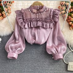 Lovely see-through long-sleeved topFabric: blendedColor: pink, white, black, apricotSize(cm): free size (1inch=2.54cm)length 52cm bust 104cm sleeve length 53cmPlease check the size carefully when you choose items,thank you. Chic Sheer Long Sleeve Blouse, Solid Color Long Sleeve Party Blouse, Long Sleeve Solid Color Blouse For Party, Feminine Long Sleeve Party Tops, Chic Blouse With Sheer Long Sleeves, Chic Long Sleeve Blouse With Sheer Sleeves, Elegant Pink Blouse With Sheer Sleeves, Solid Color Long Sleeve Party Tops, Long Sleeve Solid Color Party Tops