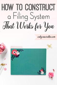 a desk with pink flowers on it and the words how to construct a filing system that works for you