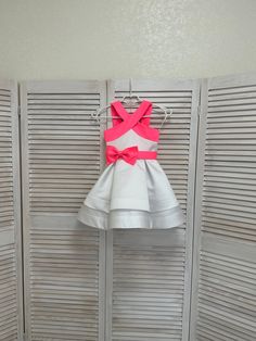 White pageant cocktail dress with pink straps and bow belt/ Pageant outfit/ Teens cocktail dress/  Custom pageant dresses This beautiful dress is made out of high quality satin. This material  has a shape and little shine. It is decorated with pink bow belt. The dress has viscose lining and zipper back. It is easy to care and comfortable to wear. The dress comes in knee length. It has tulle petticoat. The dress is perfect for all pageant events and as cocktail dress. It is absolutely stunning on White Sleeveless Pageant Dress For Spring, Elegant Summer Pageant Dress, Satin Party Dresses With Sashes, Sleeveless Fitted Pageant Dress For Summer, Pink Party Dress With Bow Tie Back, Summer Sleeveless Fitted Pageant Dress, Elegant Pink Pageant Dress For Party, Fitted Sleeveless Summer Pageant Dress, Elegant Pink Pageant Dress For Formal Occasions