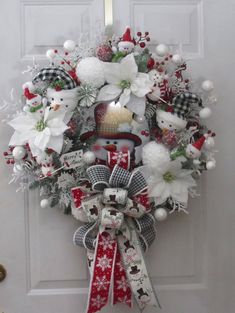 a christmas wreath hanging on the front door