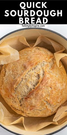 a loaf of sourdough bread in a round pan with text overlay that reads quick sourdough bread