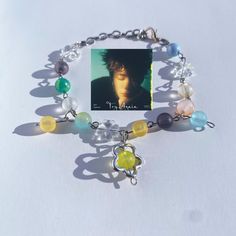 -An adjustable bracelet inspired by NCT 127's Jaehyun and d.ear's "Try Again". -The bracelet in the pic has 15 beads plus a green one, blue one and yellow one as charms. -Try NOT to expose the bracelet to water, like wearing it to the beach or showering with it. -If you have any suggestions or questions, feel free to message me. I would be more than happy to help! Handmade Y2k Style Bracelets Gift, Trendy Handmade Jewelry For Streetwear, Trendy Handmade Streetwear Jewelry, Try Again Jaehyun, Kpop Bracelet, Bracelet Y2k, Bracelet Inspired, Bracelet Cute, Kpop Merch