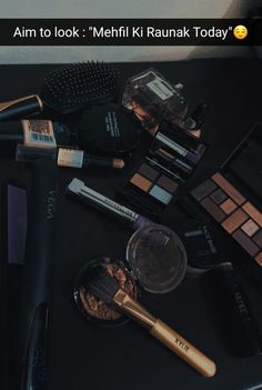 various makeup products are displayed on a black counter top with the caption'aim to look'mehrii k ruank today