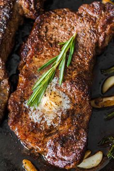 steak with herbs and garlic on a pan