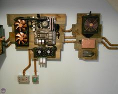 a wall mounted computer with multiple components attached to it