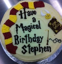 a birthday cake that has been decorated with harry potters symbols and the words have a magical birthday stephen