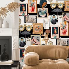 a living room filled with lots of pictures on the wall and a couch in front of it