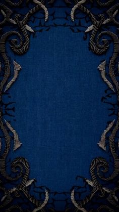 a blue and black background with an intricate design