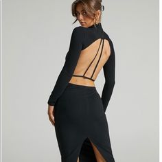 Has Light Comfy Elastic So It Stays In Place. Elegant And Sexy. It Fits Like A S/M, But Says Size L. Black Long Sleeve Dress With Cutout Back, Edgy Stretch Dresses For Night Out, Fitted Midi Dress With Cutout Back For Date Night, Black Bodycon Backless Dress, Flirty Style, Edgy Fitted Midi Dress For Night Out, Edgy Fitted Midi Dress For Party, Flirty Black Bodycon Backless Dress, Stretch Midi Backless Dress For Night Out, Edgy Fitted Midi Dress For Date Night