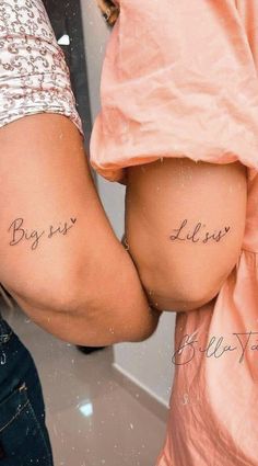 two people with tattoos on their butts and one has the words believe written in cursive writing