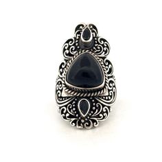 Indulge in the timeless charm of this vintage sterling silver ring, adorned with intricate marcasite detailing and featuring a striking black onyx centerpiece. Crafted with meticulous attention to detail, this exquisite piece exudes sophistication and elegance. The shimmering marcasite stones beautifully complement the deep allure of the black onyx, creating a captivating contrast that catches the eye. With a size 6 fit, this ring is perfect for adding a touch of vintage glamour to any ensemble. Vintage Oxidized Black Jewelry, Black Vintage Oxidized Jewelry, Ornate Black Sterling Silver Rings, Victorian Black Sterling Silver Rings, Victorian Style Black Sterling Silver Rings, Vintage Sterling Silver Ring With Black Enamel, Vintage Sterling Silver Rings With Black Enamel, Black Sterling Silver Vintage Rings, Vintage Black Sterling Silver Rings