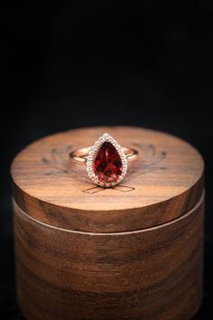 Pear-shaped Ruby Ring With Diamond Halo Setting, Pear-shaped Ruby Ring With Diamond Halo, Pear-shaped Ruby Ring With Halo Setting, Pear-shaped Halo Ring Gift, Ruby Ring With Halo Setting For Promise, Pear-shaped, Pear-shaped Ruby Ring With Halo Setting For Promise, Teardrop Halo Setting Ring For Proposal, Pear-shaped Halo Ring For Promise, Pear-shaped Halo Diamond Ring