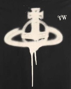 a black t - shirt with white paint dripping down the front and bottom, featuring an image of a flying saucer