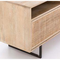 the sideboard is made out of wood and has a rattan pattern on it