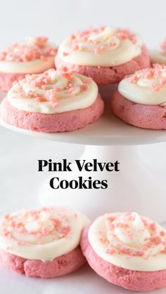 pink cookies with white frosting and sprinkles on a cake platter