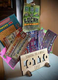 a pile of candy sitting on top of a table next to a sign that says sending you a whole love