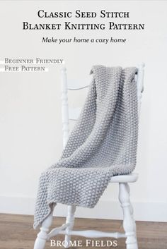 a white chair with a gray knitted blanket on it's back and the words classic seed stitch blanket knitting pattern make your home cozyy home