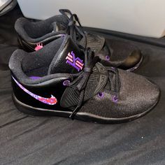 Nike Kyrie Flytrap Sneakers Big Kids Unisex- 6 Fits Woman 7.5 Matte Black With Pink And Purple Floral On The Nike Sign Brand New Purple Low-top Basketball Shoes, Nike Purple Slip-on Sneakers, Purple Lace-up Basketball Shoes With Rubber Sole, Purple Synthetic Basketball Shoes, Purple Low-top Synthetic Basketball Shoes, Purple Low-top Basketball Shoes With Rubber Sole, Nike Custom Purple Synthetic Sneakers, Custom Purple Nike Sneakers With Synthetic Material, Custom Purple Nike Sneakers In Synthetic Material